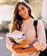 College student holding books.